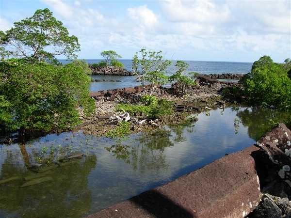 An overview of some of the shallow canals and islets that make up Nan Madol as seen from the top of one of the stacked-log towers. Image courtesy of NOAA.