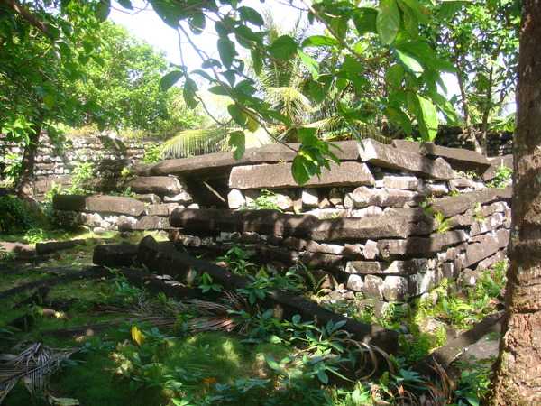 Nan Madol was a major political and spiritual hub for native Pohnpeians. The "city" was built so that the nobility were isolated from the general population. At its peak, Nan Madol may have been home to a thousand people, the majority of whom were commoners serving the nobility. Carved basalt stones carefully placed on top of each other in a crisscross pattern formed the walls of each of the 130 buildings. Some individual stones are light enough that a single person could carry them, while the heaviest of the basalt pillars weigh about 45,000 kg (100,000 lbs) each.