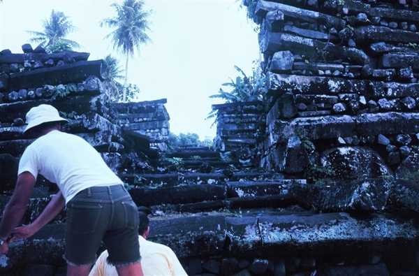 A view of a stairway leading into the interior of Nan Madol. This site was a major political and spiritual hub for native Pohnpeians. Inhabited for about 500 years (ca. 1200 to 1700), the "city" served as a religious center, a royal enclave, a fortress, an urban marketplace, and the high seat of government for the island of Pohnpei. During its height, Nan Madol was the seat of the Saudeleur Dynasty, which united all of Pohnpei's estimated 25,000 people. The Saudeleur were originally a foreign tribe who came to Pohnpei and installed themselves as rulers of the island. The Saudeleur first appeared around the year 1100 and built Nan Madol around 1200. Photo courtesy of NOAA.