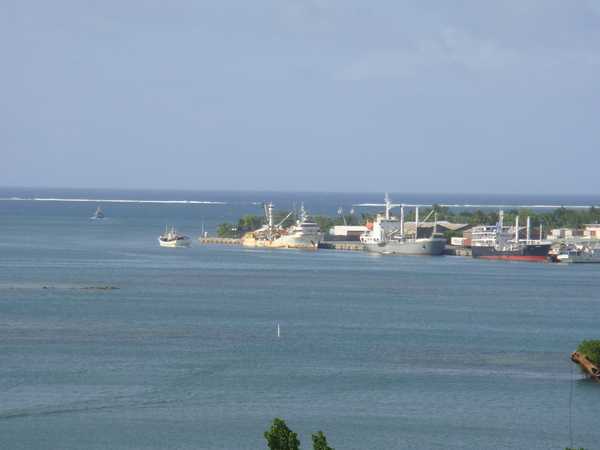 The harbor on Pohnpei. In the background is the surf line along the outer reef.