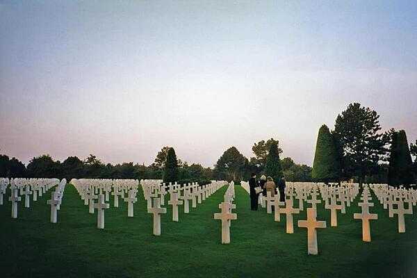 Rows of crosses at the American Cemetery in Colleville-sur-Mer, Normandy. Located on a bluff overlooking Omaha Beach (one of the landing beaches for the Normandy Invasion of 1944), the cemetery contains the remains of 9,387 American military dead.