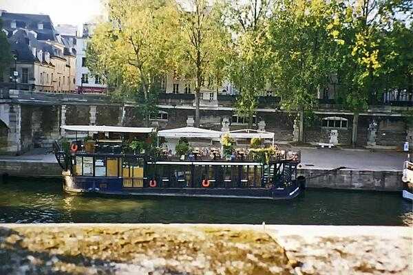 Flower festooned boat on the Seine River in Paris.