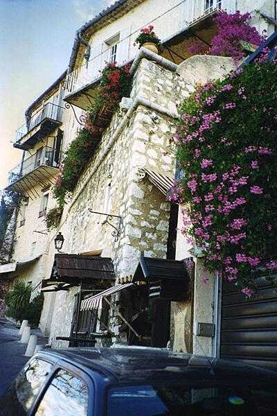 Flowers drip from balconies in the town of Saint-Paul de Vence in Provence.