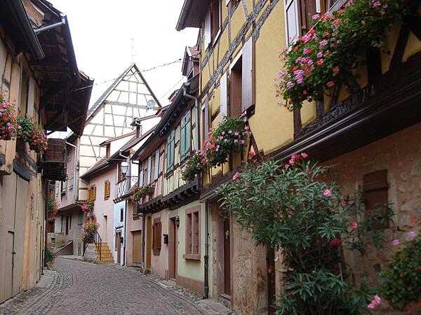 Street scene along the flower-lined streets of Eguisheim.