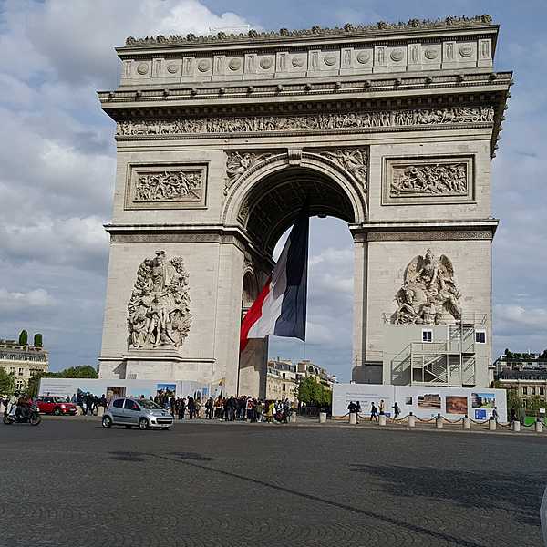 The Arc de Triomphe is one of the most famous monuments in Paris, standing at the western end of the Champs-Elysees at the center of Place Charles de Gaulle. The Arc de Triomphe honors those who fought and died for France in the French Revolutionary and Napoleonic Wars, with the names of all French victories and generals inscribed on its inner and outer surfaces. Beneath its vault lies the Tomb of the Unknown Soldier from World War I.