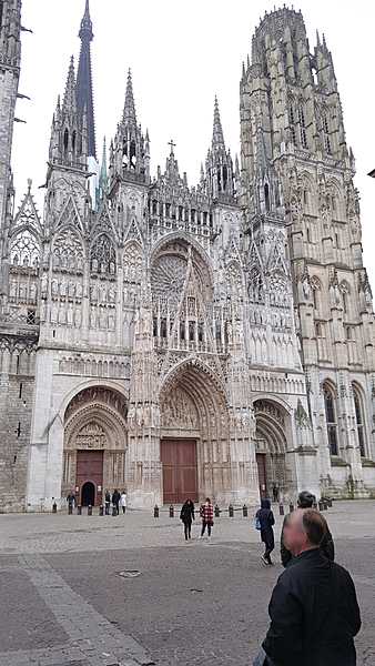 The facade of the Cathedral Notre-Dame at Rouen, Normandy. The cathedral, built and rebuilt over a period of eight hundred and fifty years (groundbreaking in 1030, completion in 1880), has features from Early Gothic to late Flamboyant and Renaissance architecture.