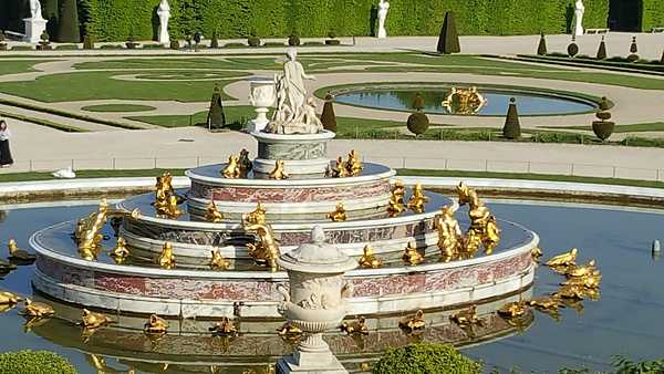 The Latona Fountain, located in the center of the garden at the Palace de Versailles, is inspired by the myth of Latona, mother of Apollo and Diana, and her encounter with the peasants of Lycia. Insulted by the peasants, she punished them by changing them into frogs.  Latona is pictured at the top of fountain with the frogs at the bottom. This tale from Apollo’s childhood appealed to Louis XIV since he had chosen the sun god as his emblem.