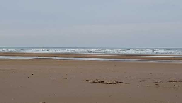 This photo shows a calm Normandy Beach, but on 6 June 1944 it was the site of the largest amphibious military operation in history, D-Day.  Officially known as “Operation Overlord,” the invasion began the liberation of France (and later the rest of Europe) from the Nazis and laid the foundation for the Allied victory on the Western Front. The Normandy landings took place across an 80 km (50 mi) stretch of beach divided into five sectors: Utah, Omaha, Gold, Juno, and Sword.  The total invasion force was comprised of 6,000 landing craft, ships, and other vessels carrying 176,000 troops, 822 aircraft filled with paratroopers, and an additional 13,000 aircraft to provide air cover and support.