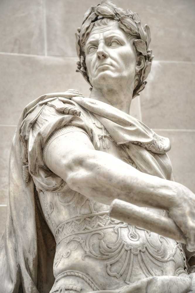 This marble statue of Julius Caesar by French sculptor Nicolas Coustou was commissioned in 1696 for the Gardens of Versailles and later transferred to the Louvre Museum.  Julius Caesar is shown in his Roman armor with a cloak and a marshals baton which depicts him as a general and a statesman.