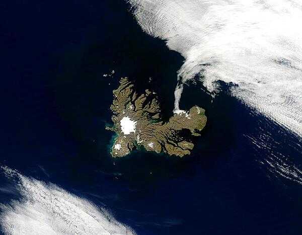The Kerguelen Islands lie in the South Indian Ocean in a triangle formed by Australia, Africa, and Antarctica. At 1,850 m, the islands&apos; highest point is Mount Ross, capped by a white glacier in this satellite image. Glaciation is also evident in the jagged fjords cut into the islands. The Kerguelen Islands, a territory of France, consist of one main island surrounded by about 300 smaller islands. Photo courtesy of NASA.