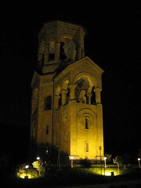 A nighttime view of the free-standing bell tower and chapel of the Sameba (Holy Trinity) Cathedral, a part of the Sameba complex on Elia Hill overlooking Tbilisi.