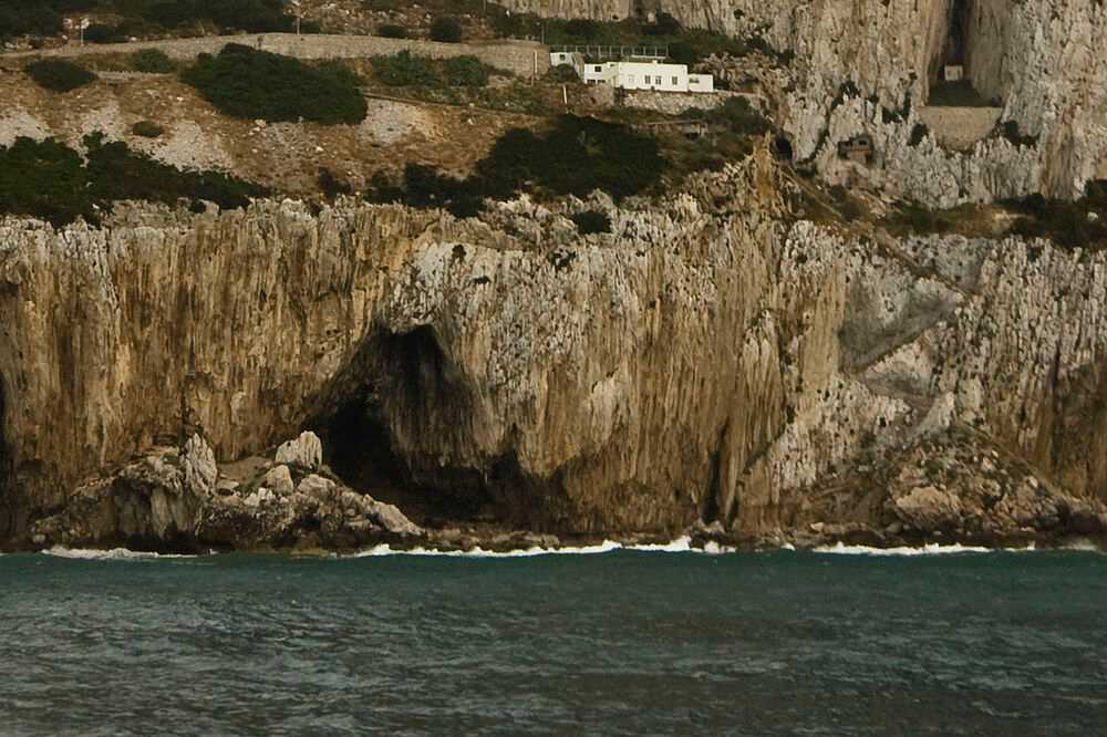 Gorham's Cave Complex is located in steep limestone cliffs on the eastern side of the Rock of Gibraltar. The complex includes four caves – named Vanguard, Hyaena, Bennett, and Gorham – that are believed to be one of the last habitations of Neanderthals in Europe. The complex is named after British Captain A. Gorham of the British Army’s 2nd Battalion Royal Munster Fusiliers, who discovered it in 1907.