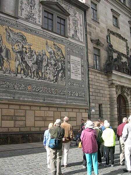 The Fuerstenzug, located on the outside wall of the Residence Palace in Dresden, depicts the rulers of Saxony over 1,000 years. It is the largest (and longest) porcelain picture in the world, composed of ca. 25,000 porcelain tiles (only the concluding section is shown here). The dimensions are 102 m by 9.5 m (957 sq m).