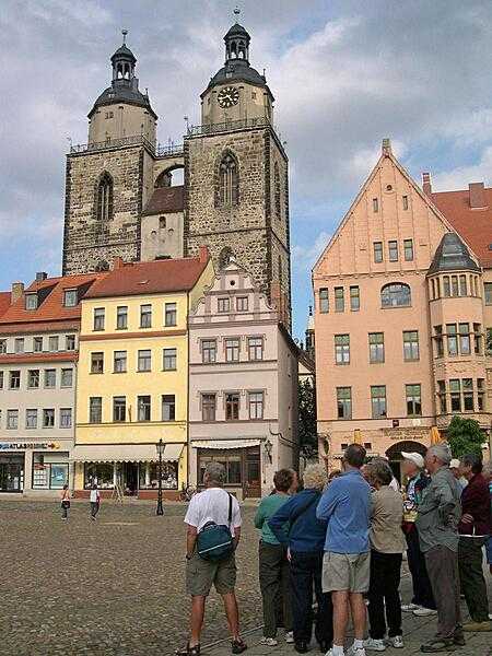The Market Place of Wittenberg with the Stadt Kirche (City Church) - also known as Marienskirche (St. Mary&apos;s Church) or Mother Church of the Reformation - in the background. Luther did most of his preaching in the church, some parts of which date to the 13th century.