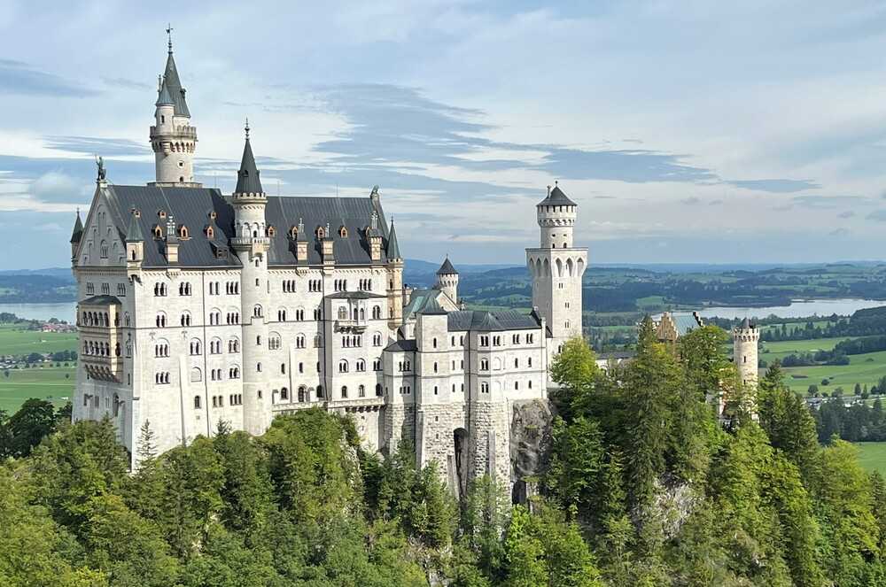 Neuschwanstein Castle, located in the foothills of the Alps in Germany, is the best known of the three royal palaces built by King Ludwig II of Bavaria. Construction began in 1869, and although it was inhabitable by 1873, it was never finished. Often referred to as “the paradox castle,” it was built at a time when castles were no longer necessary, and it was outfitted with the latest technological comforts such as an elevator, running water, electricity, telephones, and central heating. King Ludwig lived off and on in the castle for six months before dying in 1886. A few weeks after his death, the castle opened to the public as a museum; today it welcomes millions of visitors each year.