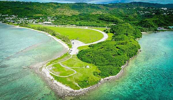 Aerial view of Asan Ridge and the War in the Pacific National Historical Park. Established in 1978, the Park is composed of various sites on the western shore of the island; it is unique in the US National Park System in that it honors all those who participated in the Pacific Theater of World War II. During the Second World War, Guam was captured by Japanese forces in 1941 and liberated by the Americans in 1944. The Park includes former battlefields, gun emplacements, trenches, caves, and historic structures. Photo courtesy of the US National Park Service.