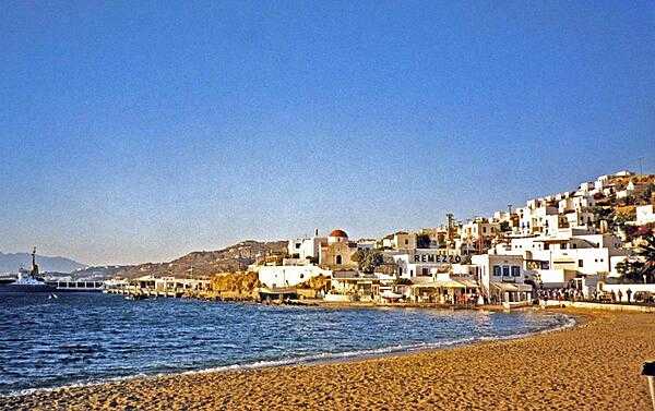 The town of Mykonos on the eponymous island in the Aegean Sea. A tourist destination of sandy beaches and diverse night life, Mykonos is well known for its many windmills.