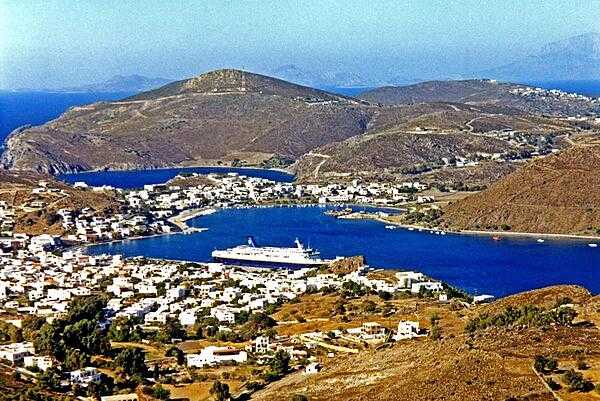 Harbor and ship on the island of Patmos, as seen from the shrine of St. John the Evangelist. According to tradition, it was here that the saint, living in exile from Ephesus, wrote the Biblical &quot;Book of Revelations.&quot;