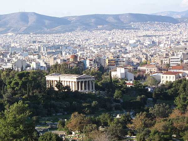 View of Athens as seen from the Acropolis. The prominent, well-preserved structure in the left center is the Temple of Hephaestus.