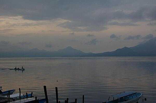 The volcanic Lake Atitlan at sunrise, as the fishermen begin their day.