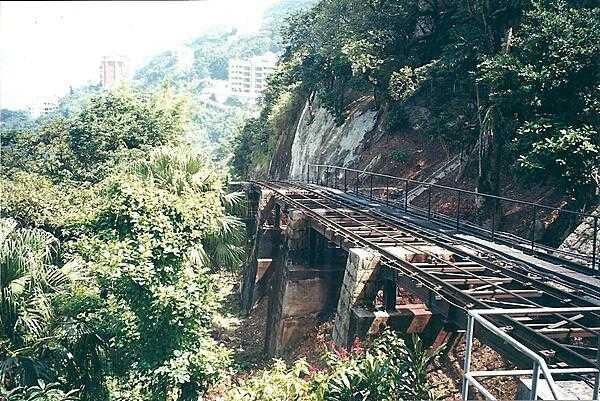 The Peak Tramway is a funicular railway that carries tourists and residents to the upper levels of Hong Kong Island.