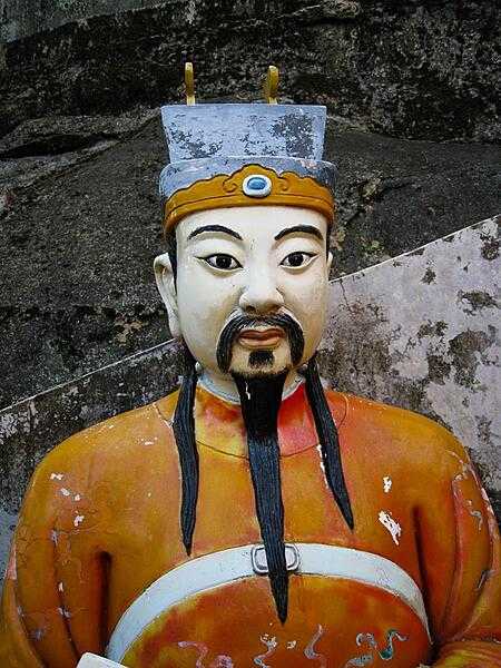 One of the many life-size statues lining the steep staircase leading to the Temple of 10,000 Buddhas in Hong Kong.