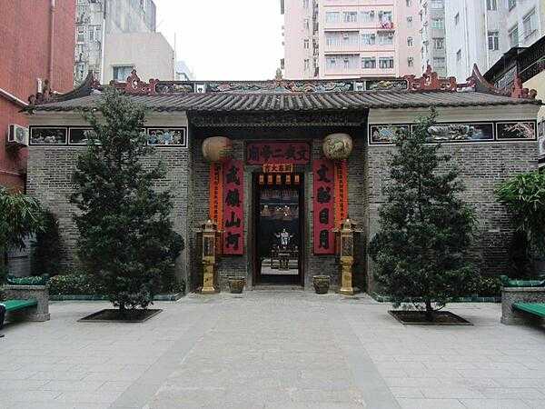 The Man Mo Temple in Tai Po, Hong Kong is 26 km (16 mi) from the harbor. The temple, dedicated to Man (literature) and Mo (military), was built in 1893 in the style of a central walled compound to emphasize seclusion.