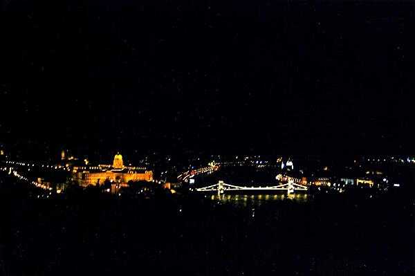 Budapest at night. The beautiful Szechenyi Chain Bridge links Buda on the left with Pest on the right.