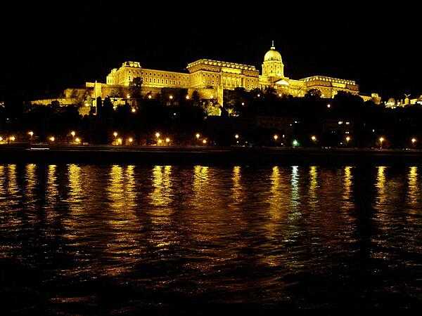 A night-time view of Buda's Royal Castle as seen from along the Danube in Pest.
