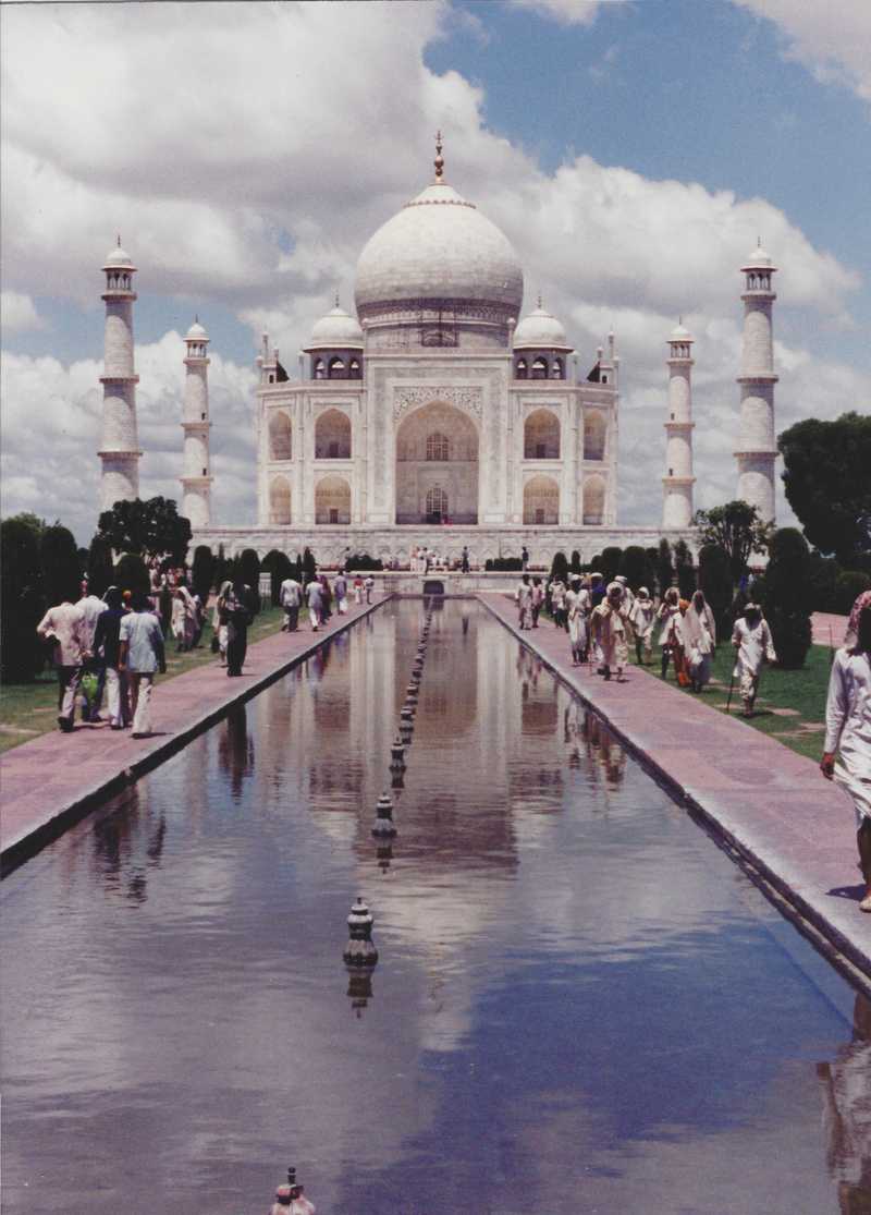 The Taj Mahal's reflecting pool is flanked by Cypress trees and provides a reflection of the mausoleum. The marble tomb complex in Agra was constructed in the 17th century by Emperor Shah Jahan in homage to his favorite wife Mumtaz Mahal.