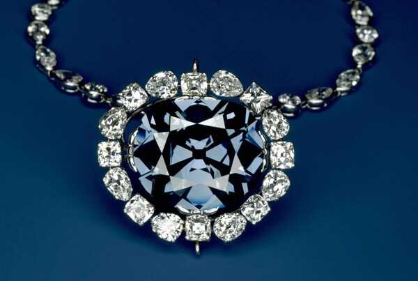 The 45.52-carat blue-violet (9.104 g) Hope Diamond was extracted in the 17th century from the Kollur Mine in Guntur, India; its blue in color is due to trace amounts of boron. The diamond has had a succession of owners including the crowned heads of France and the United Kingdom. In 1839, the stone received its name when it was purchased by Henry Phillip Hope of the Hope banking family. Decades later, Pierre Cartier bought it at auction in 1909 and reset it to its present look of being encircled by 16 pear- and cushion-cut white diamonds. Mrs. Evalyn Walsh McLean, a socialite from Washington, D.C., purchased it from Cartier and later reset it to the now familiar necklace.  After Mrs. Mclean’s death in 1947, Harry Winston, Inc. purchased the Hope Diamond and exhibited it for 10 years at shows and charitable events worldwide before donating it the Smithsonian Institution on 10 November 1958 where it remains a premier attraction in the Smithsonian Natural History Museum. Photo courtesy of the Smithsonian Natural History Museum / Chip Clark.
