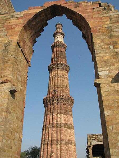 Qutb Minar, built in the early 13th century, is in the south Delhi neighborhood of Mehrauli; it is the world's tallest brick minaret and the second tallest tower in India.  The red sandstone structure is 72.5 m (238 ft) high with 379 steps leading to the top. The area surrounding the minaret contains funerary buildings, two mosques, towers and the Alai Darwaza Gate. It became a UNESCO World Heritage site in 1993.