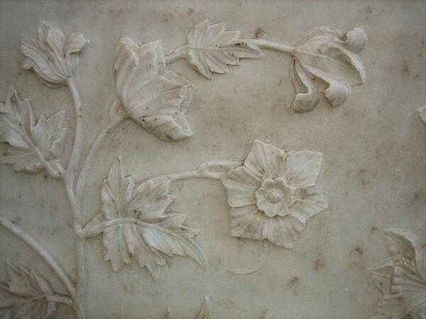 Realistic bas-relief floral design in marble at the Taj Mahal.