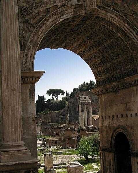 The Roman Forum and Palatine Hill as seen through the Arch of Septimius Severus in Rome. The Arch was constructed in A.D. 203.