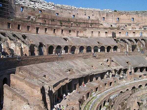 The Colosseum in Rome, the largest ever built in the Roman Empire, could seat 50,000 (some estimates go as high as 80,000). Begun in A.D. 72 and completed in A.D. 80, it accommodated gladiatorial contests, games, and spectacles. This is a view of its ruins from the inside.