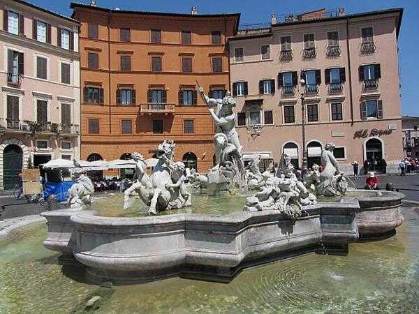 Fontana del Nettuna (Fountain of Neptune) in the Piazza Navona in Rome. The fountain was constructed in 1574 by Giacomo della Porta. The statue of Neptune by Antonio della Porta was added in 1878.