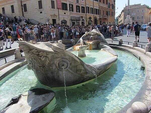 Fountain of a sinking boat in the Plaza di Spagna in Rome close to the Spanish Steps. The fountain is believed to be by Pietro Bernini.