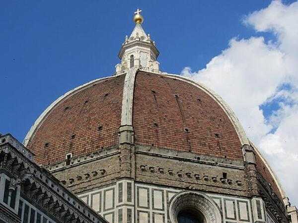 The dome of the Basilica di Santa Maria del Fiore (Basilica of St. Mary of the Flower), also referred to as the Duomo (Cathedral), in Florence. Work on the Duomo began in 1296. The dome, designed by Filippo Brunelleschi, was built between 1420 and 1436.