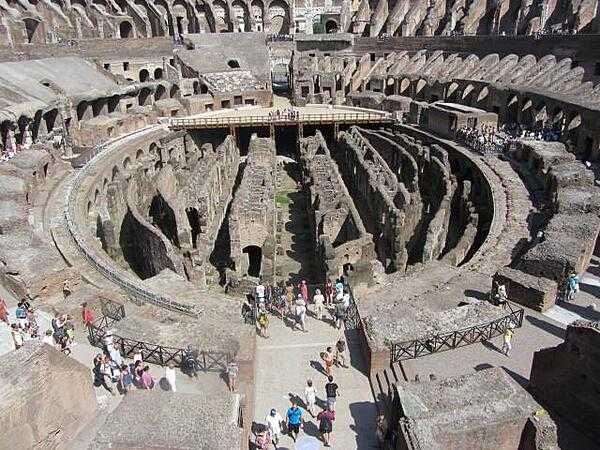 The Colosseum in Rome showing the interior with a partial reconstruction of the wooden arena floor. The rooms and passageways under the floor were used for performers, sets, and animals. The arena could be flooded to recreate sea battles.