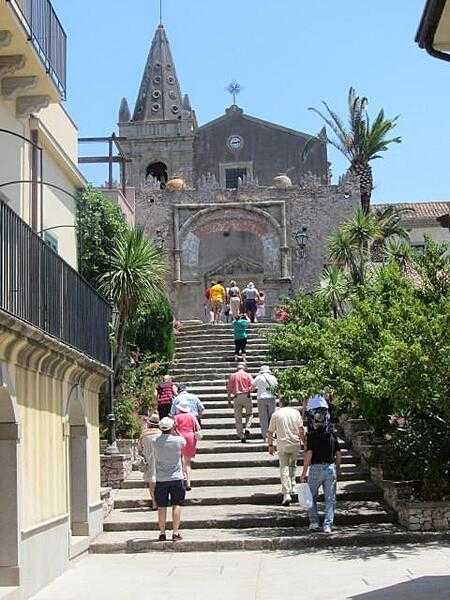 Steps leading to the Church of the Holy Trinity and to the Convento Agostiniano (Augustinian Convent) in Forza d&apos;Agro in Sicily. The arch is named the Porta Durazzo.