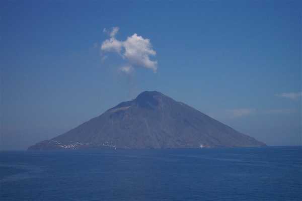 Stromboli Volcano in the Aeolian Islands. Mount Stromboli has been in almost continuous eruption for more than 2,000 years; its last serious discharge occurred in 1921. The volcano’s eruption pattern consists of summit crater explosions, with mild to moderate eruptions of incandescent volcanic bombs, a type of tephra, at intervals ranging from minutes to hours. This pattern of emission is referred to as Strombolian eruption and is also observed at other volcanoes worldwide. Photo courtesy of NOAA / Michael Theberge.