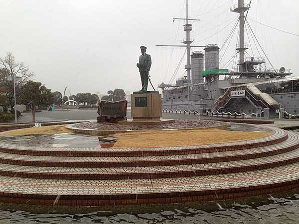 Mikasa is a pre-dreadnought battleship built for the Imperial Japanese Navy in the late 1890s. The ship served as the flagship of Vice Admiral Togo Heihachiro (the statue in the foreground) throughout the Russo-Japanese War of 1904–1905, including the Battle of Tsushima. She has been partially restored and is now a museum ship located at Mikasa Park in Yokosuka. Mikasa is the last remaining example of a pre-dreadnought battleship anywhere in the world.