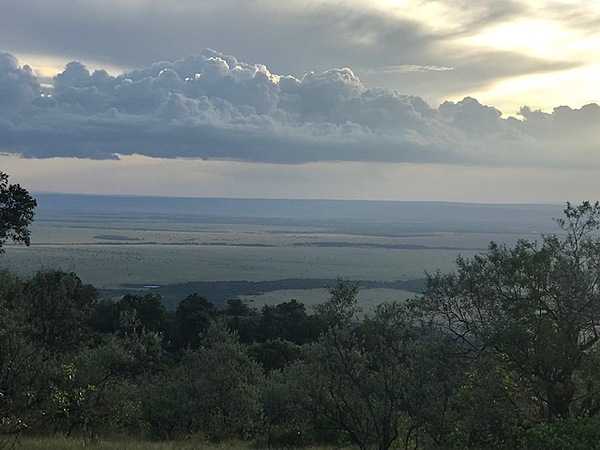 Cirrostratus (upper) and cumulus (lower) clouds over the Mara Masai plains.
