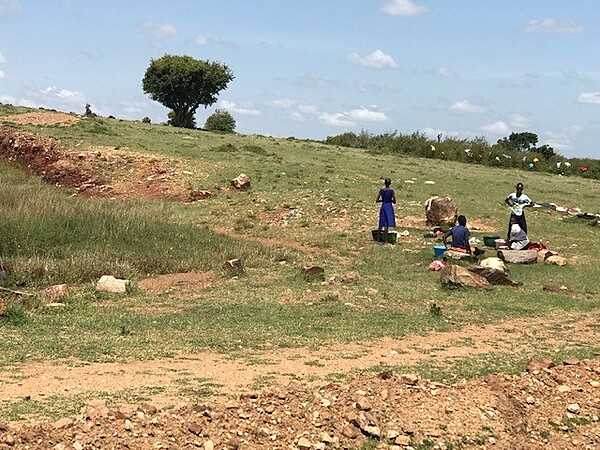 Saturday is laundry day in the Mara. Laundresses in rural areas wash with buckets and rocks. The clothing is then dried on the bushes. Many women must walk miles each day to retrieve water, and do laundry in streams, after the animals have had their fill.