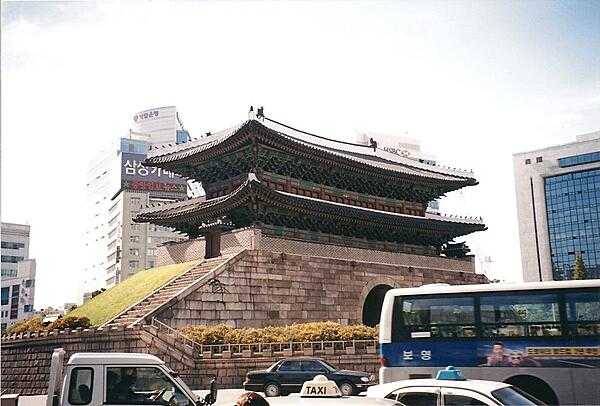 Namdaemun (Sungnyemun) in Seoul was the &quot;Great Southern Gate&quot; in the walls that once surrounded the city. This view was taken before the wooden upper portion was destroyed in a 2008 fire and subsequently restored.