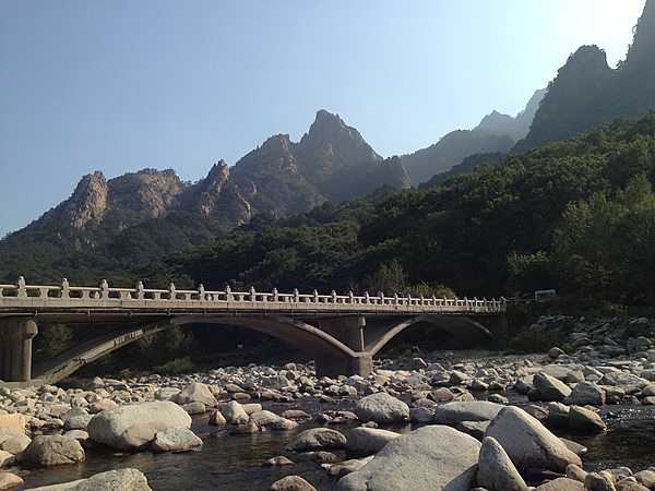 Stone bridge across a rocky riverbed in the Seorak Mountains.