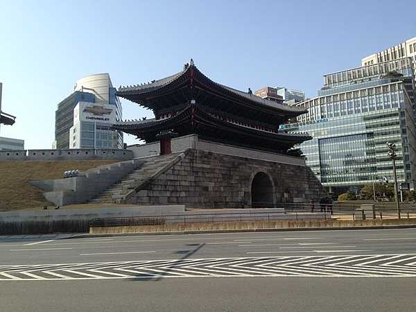 Namdaemun (Sungnyemun) in Seoul was the "Great Southern Gate" in the walls that once surrounded the city. This view was taken after the restoration of the upper wooden section that was destroyed in a 2008 fire.