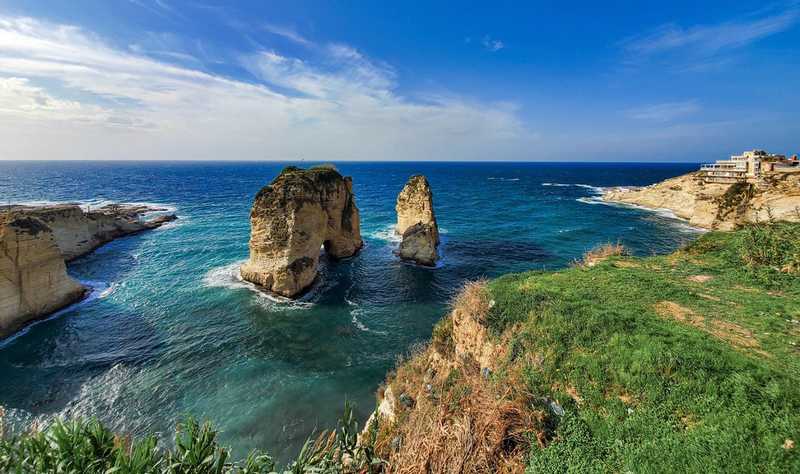 Pigeon Rocks are two iconic sea stacks just offshore from Raouche, a residential and commercial neighborhood outside in Beirut. The rocks are both approximately 60 m (196 ft) high rising out of the Mediterranean Sea. Their layers (striations) were laid down millions of years ago in an ancient sea.