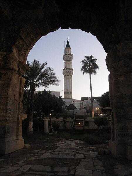The Arch of Marcus Aurelius is the largest remaining Roman relic in Tripoli. Here seen framing a local minaret, the monument dates to the second half of the second century A.D.
