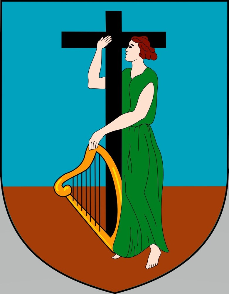Montserrat’s coat of arms dates back to 1909 and reflects the country’s Irish settlers, who first arrived in 1632. The woman in the green dress is Erin, the personification of Ireland, and she holds Ireland’s symbol, a gold harp. The cross represents Christianity, Monserrat’s predominant religion.